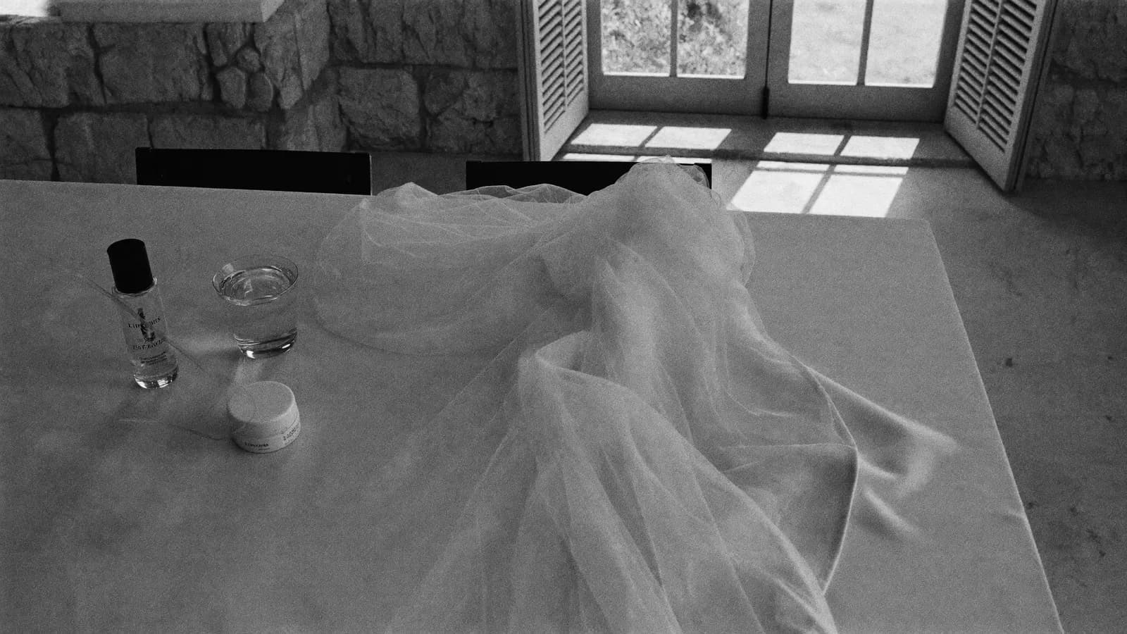 A bride's dressing table in a Maltese villa with soft light through shutters